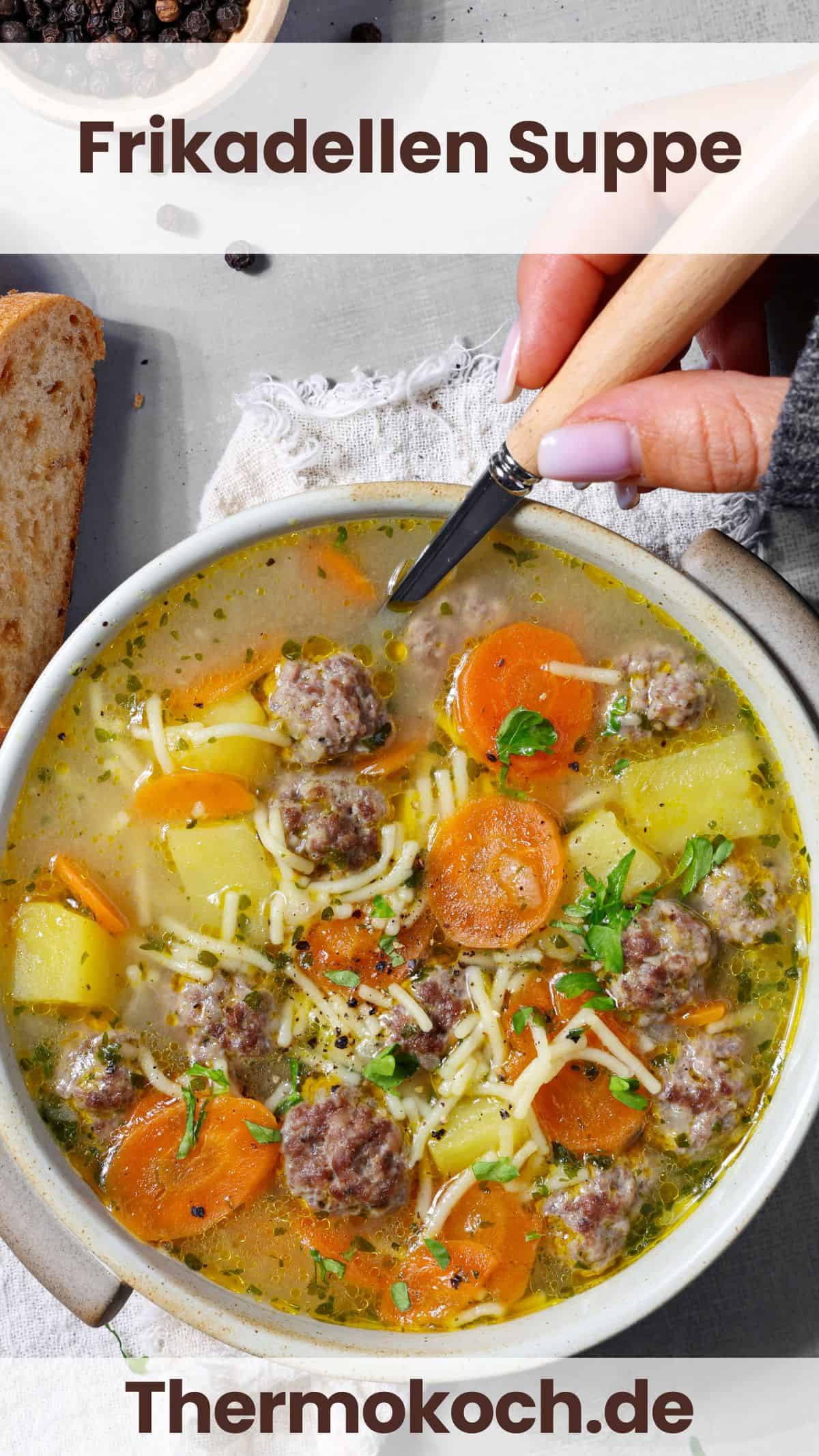 A white bowl filled with comforting meatball soup.
