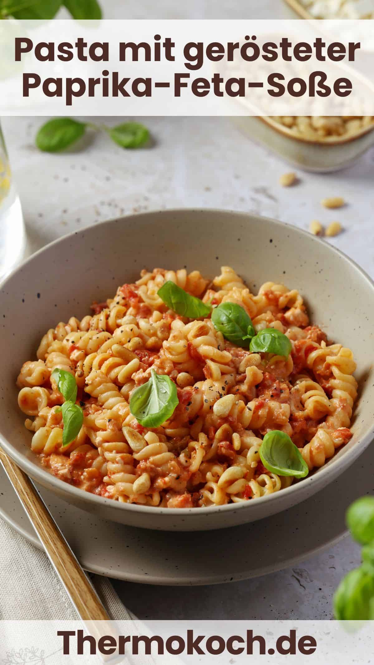 A bowl of pasta with creamy roasted red pepper and feta sauce.
