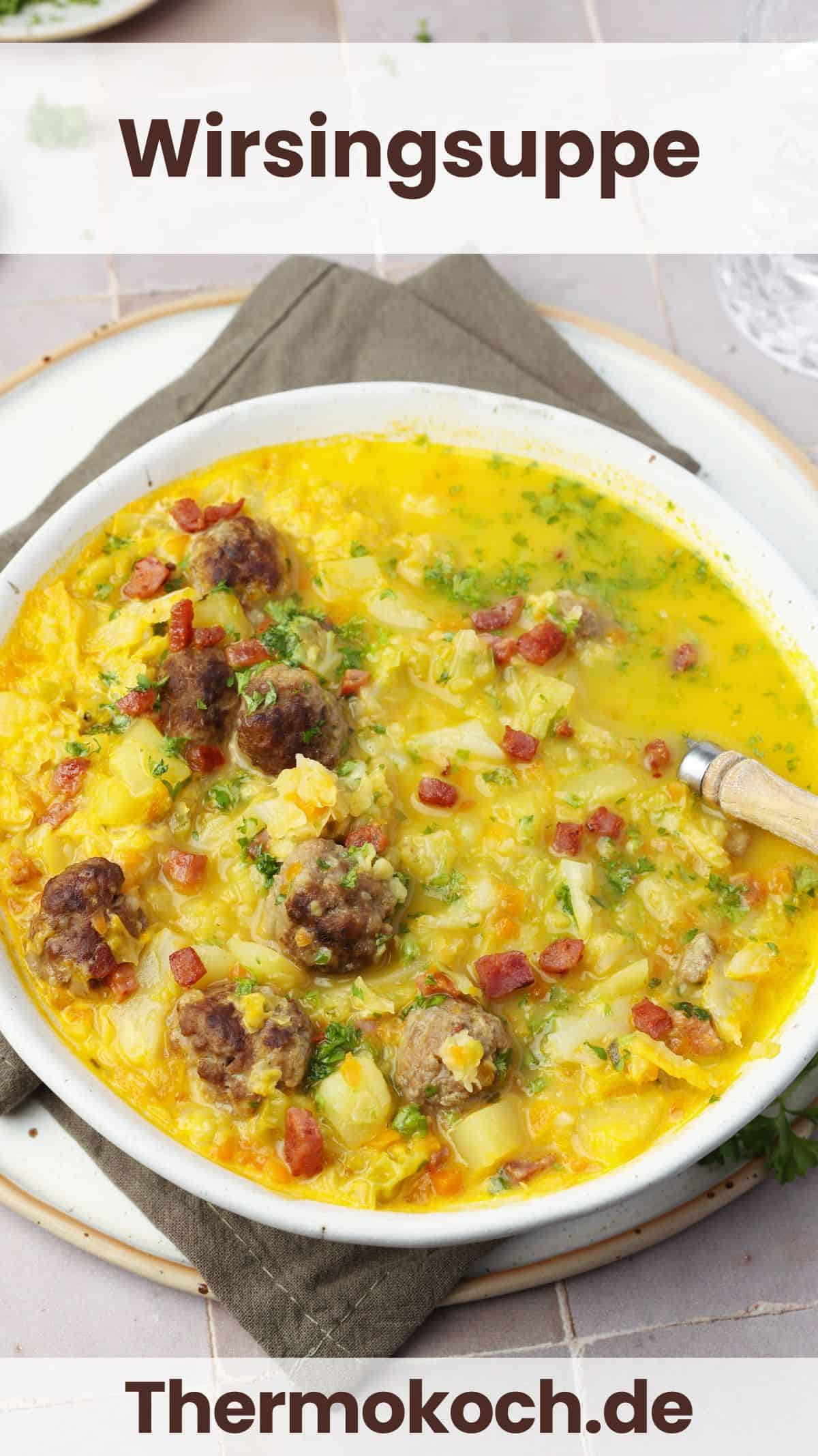 A white soup bowl filled with savoy cabbage soup with meatballs.