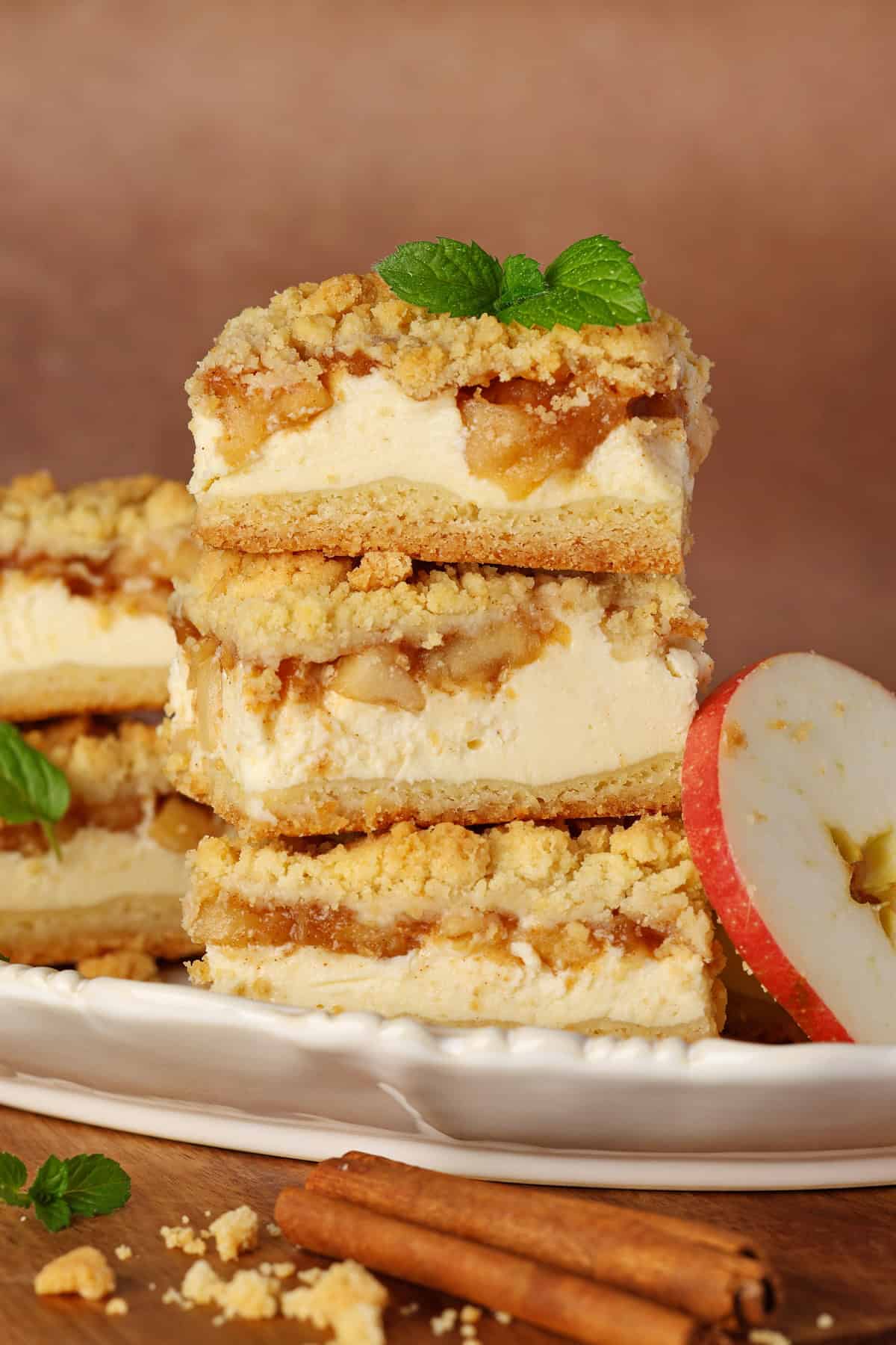 A stack of apple streusel cheesecake slices.