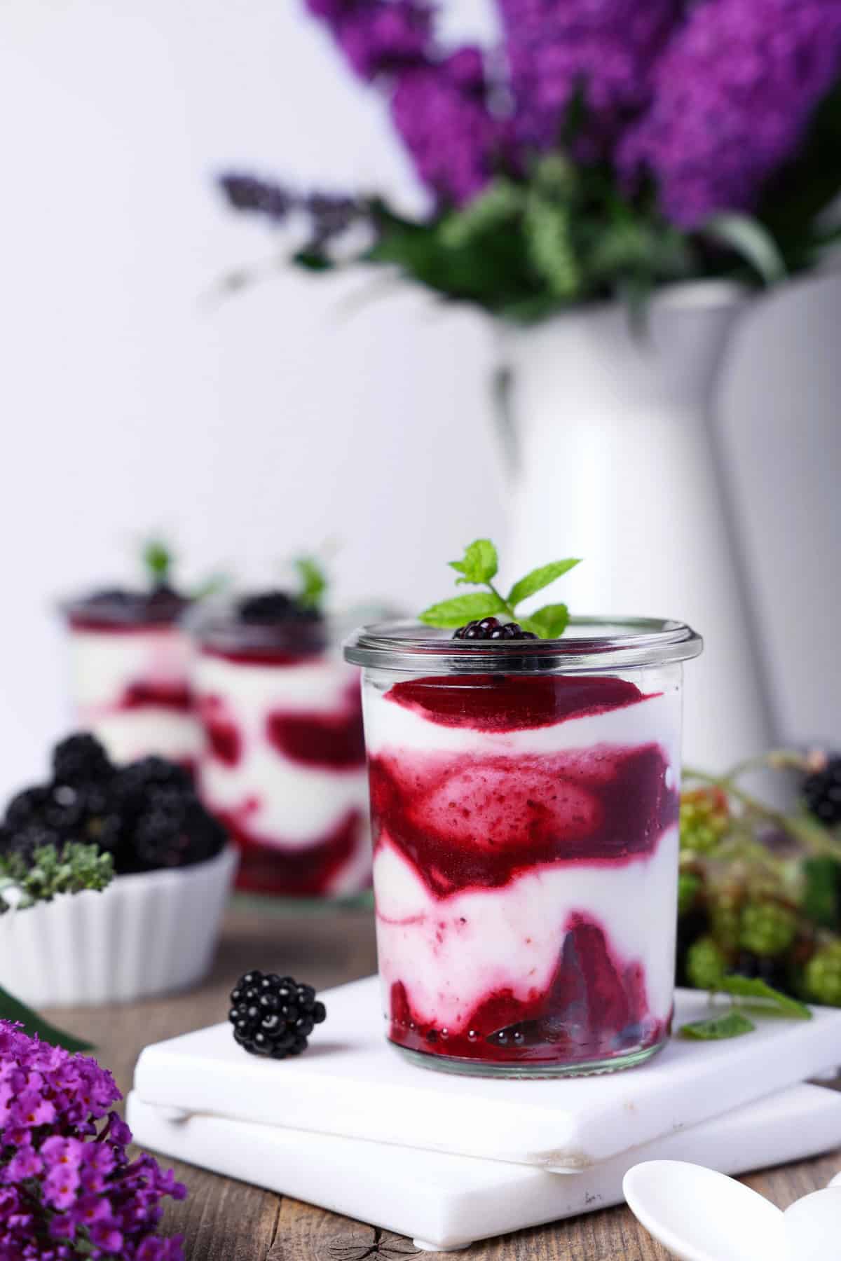 A glass of blackberry mascarpone trifle.