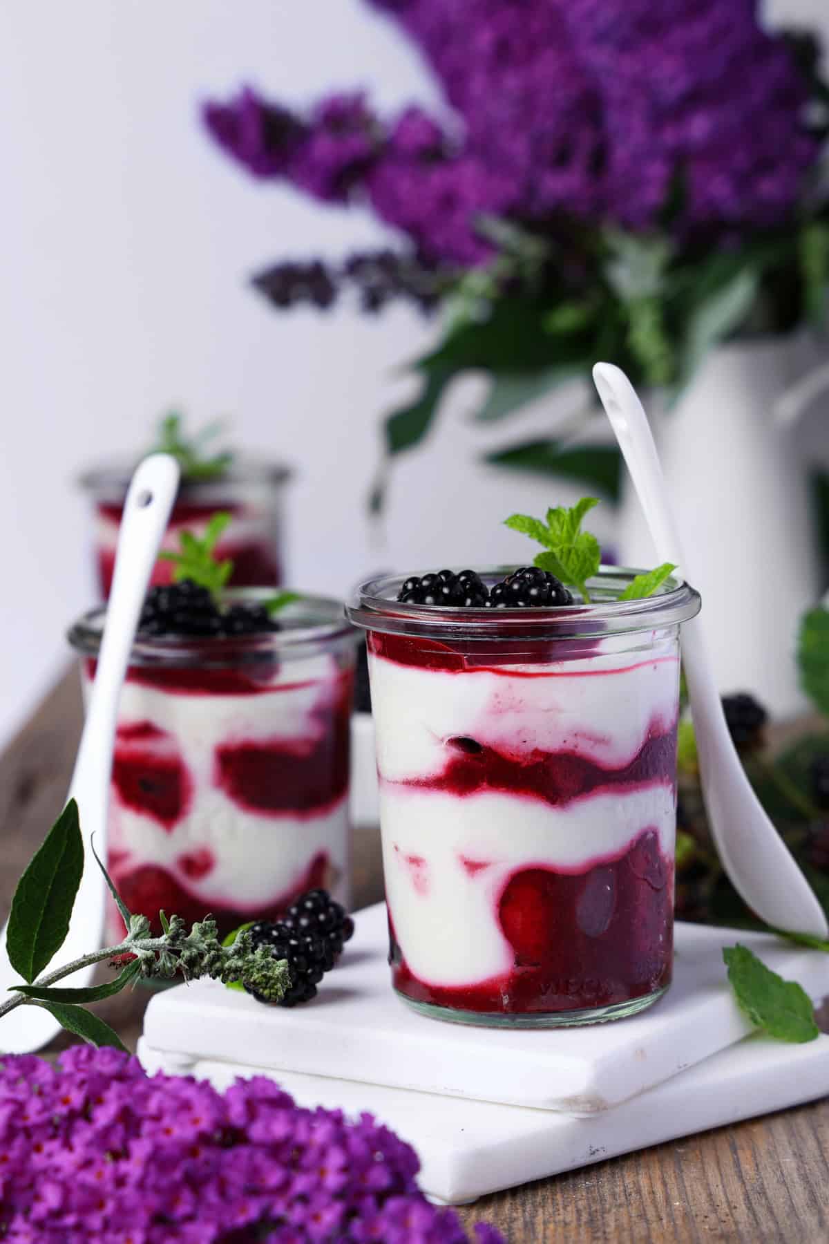 Two glasses of blackberry mascarpone trifle.