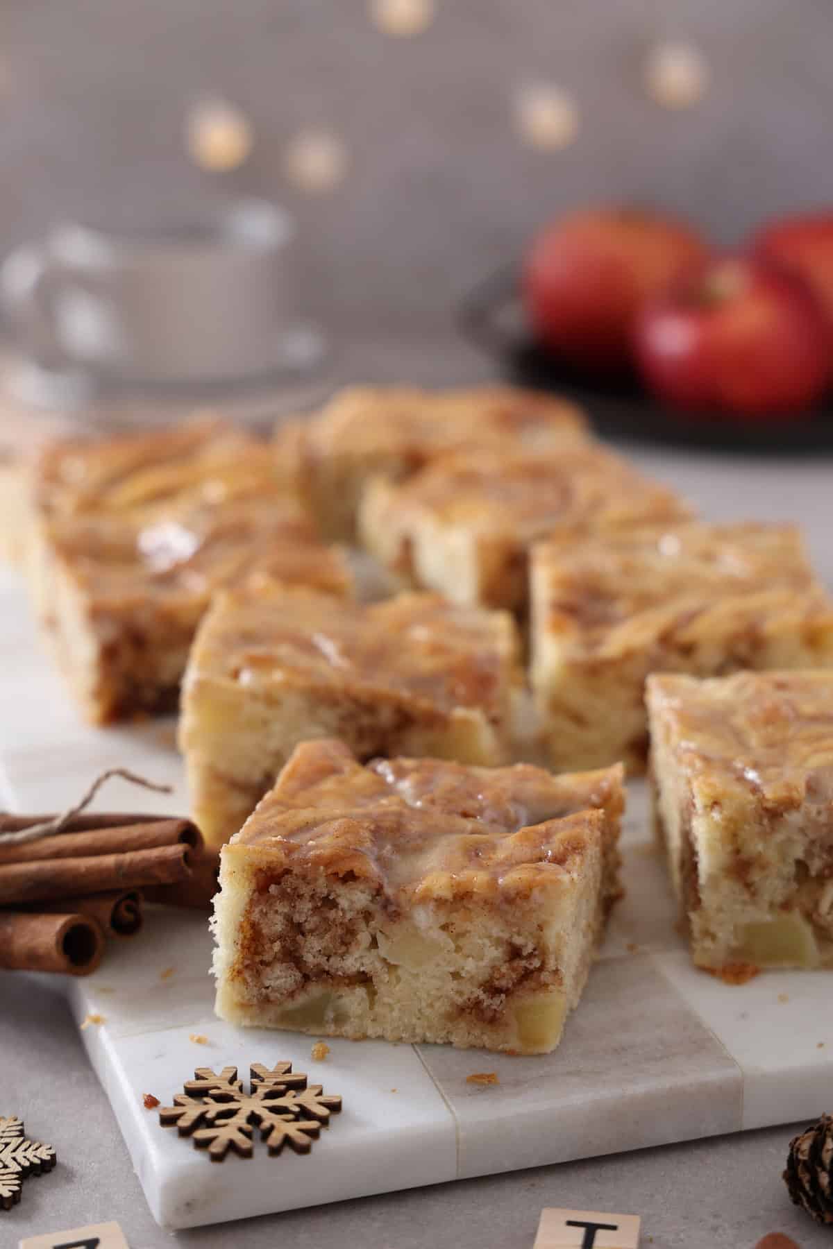 Several slices of apple cinnamon roll cake on a serving tray.