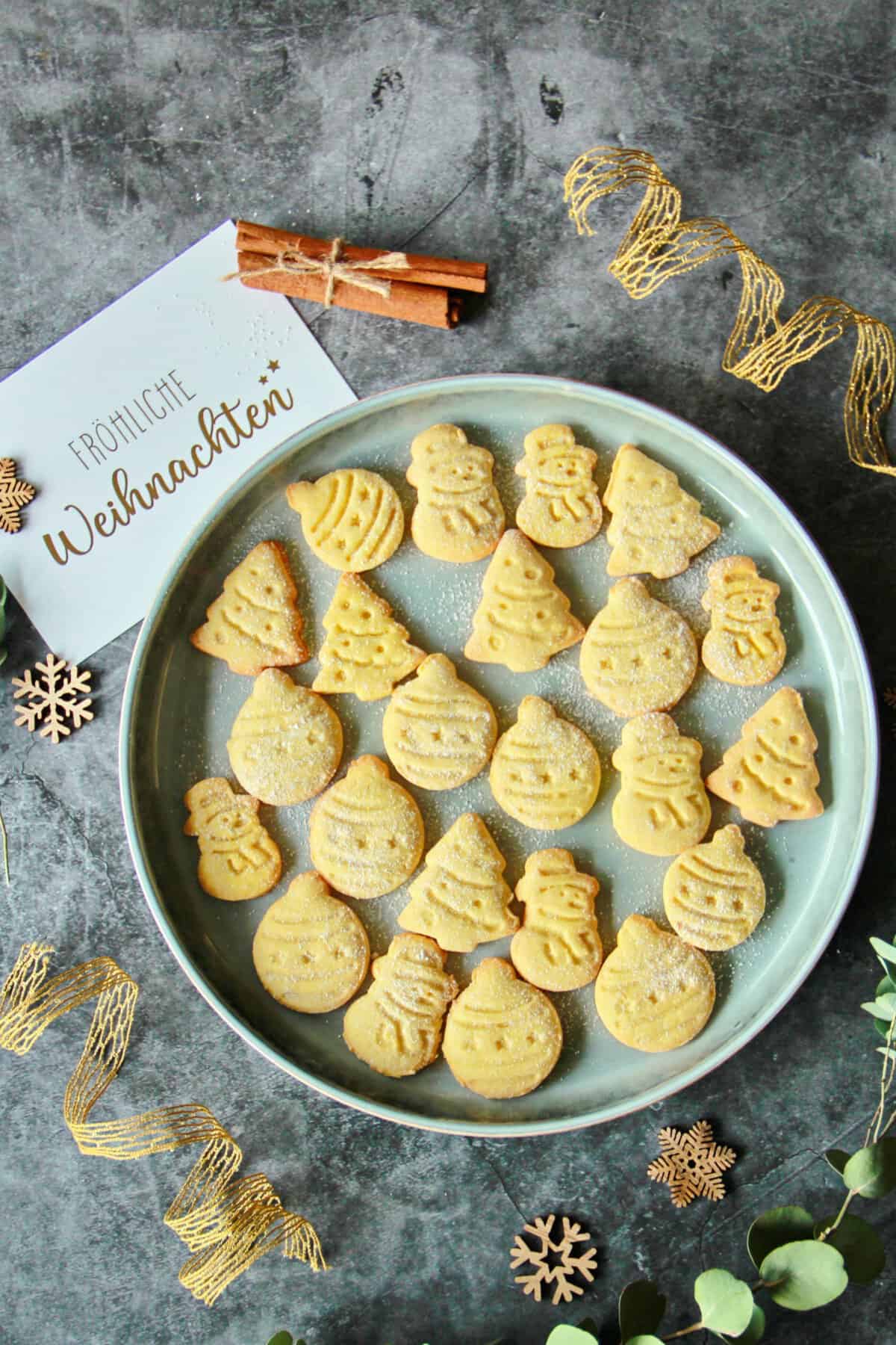 Christmas cookies decoratively arranged on a plate.