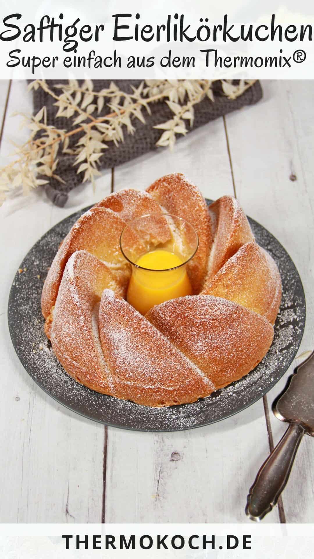 An egg liqueur cake on a round dark serving platter.