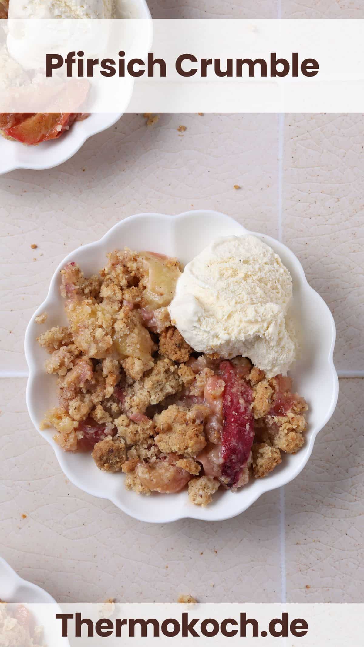 A serving of peach crumble with hazelnut crumb topping and a scoop of ice cream in a small bowl.