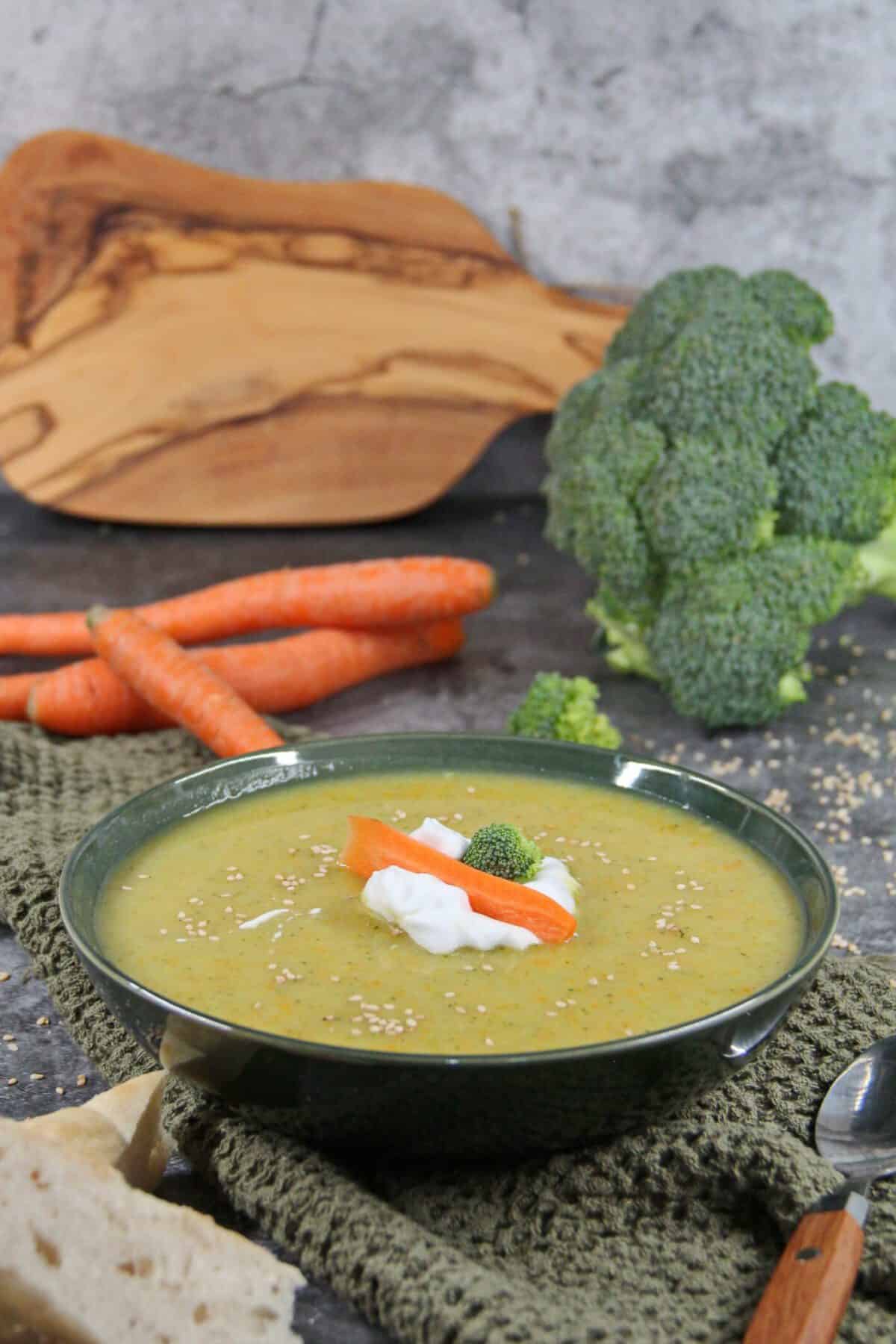 A dark bowl filled with creamy potato soup.