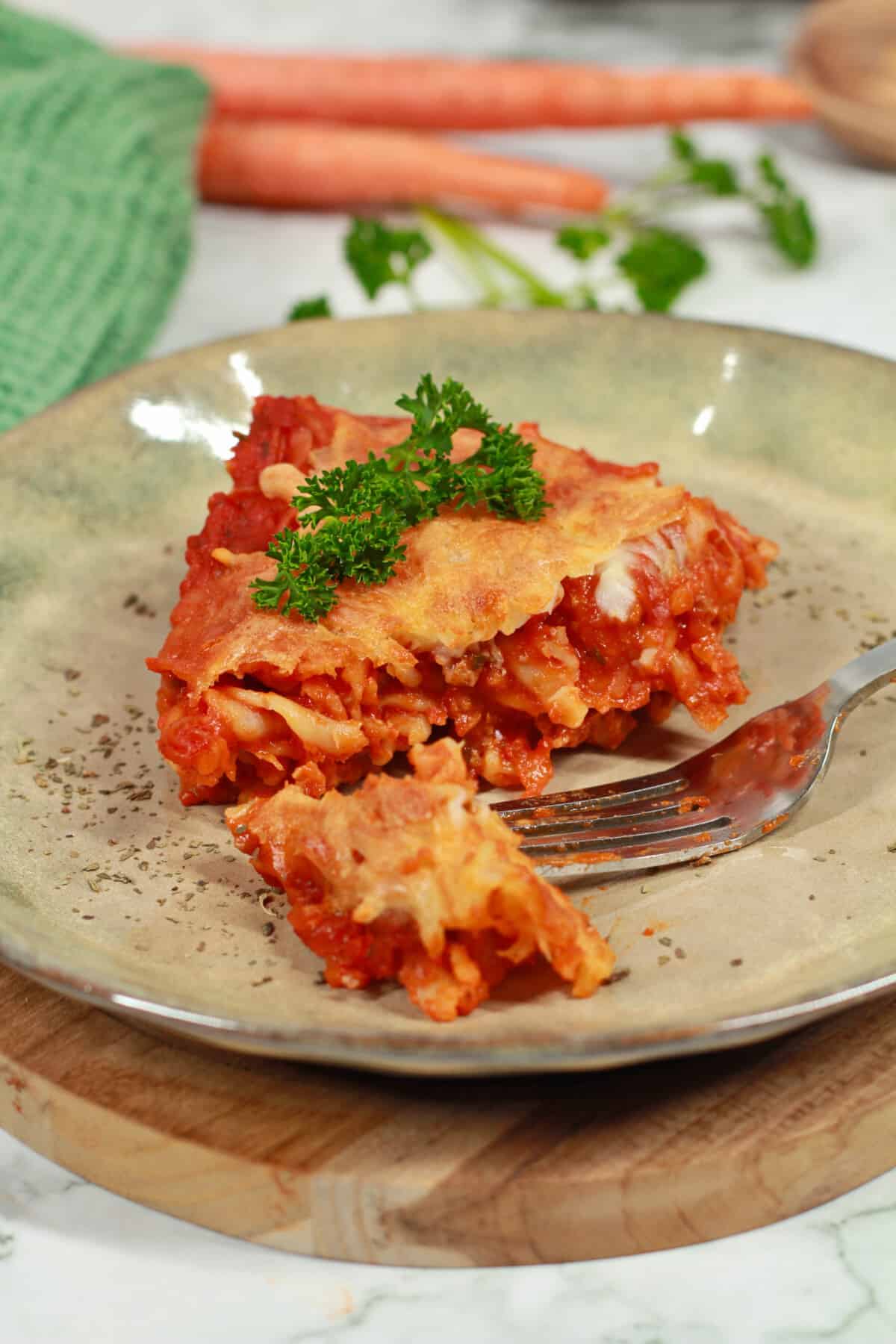 A slice of baked pasta served on a plate.