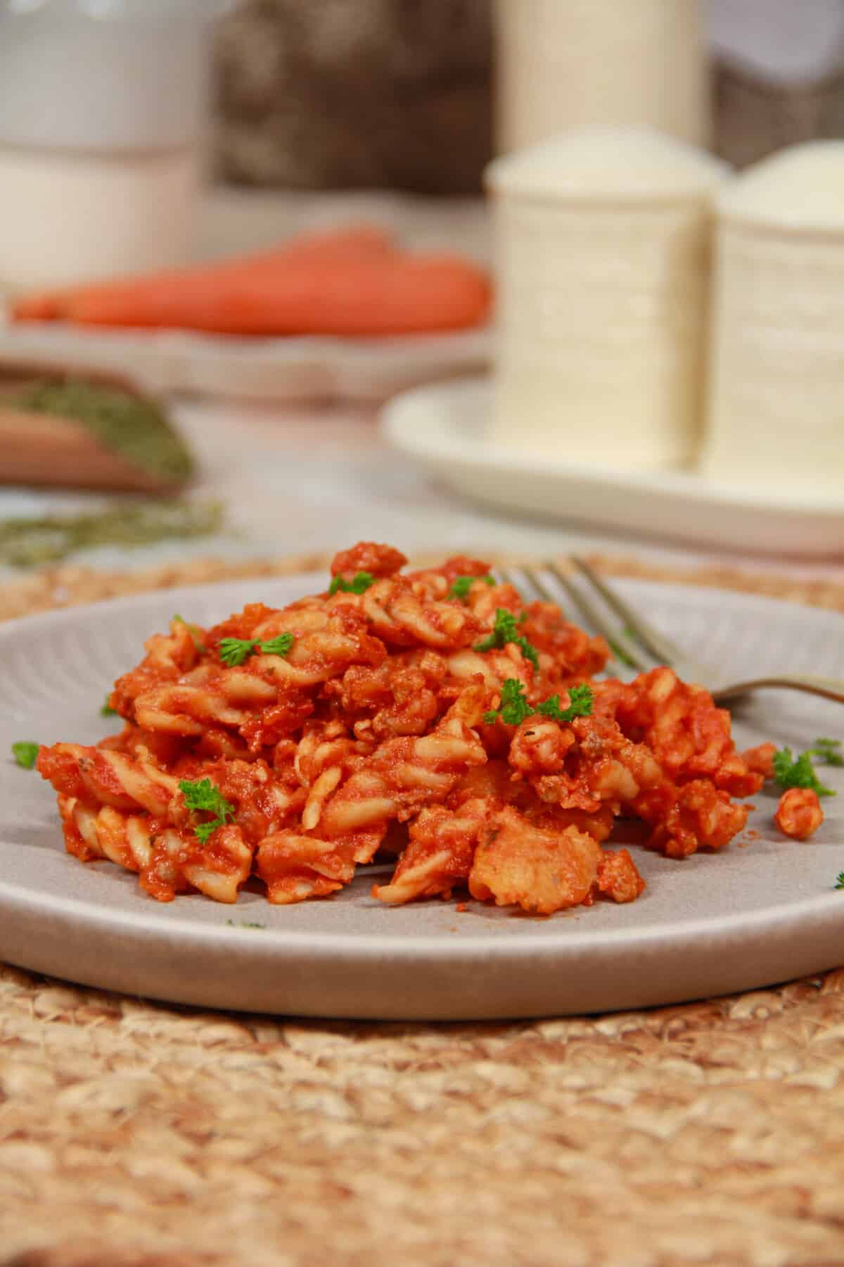 A gray plate filled with pasta bake.